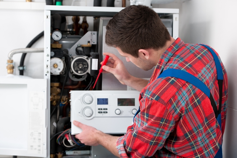 Gas Safe engineer working on a boiler in Beckenham